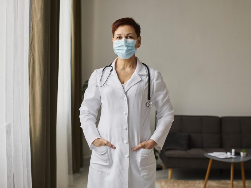 front-view-of-elder-covid-recovery-center-female-doctor-with-medical-mask